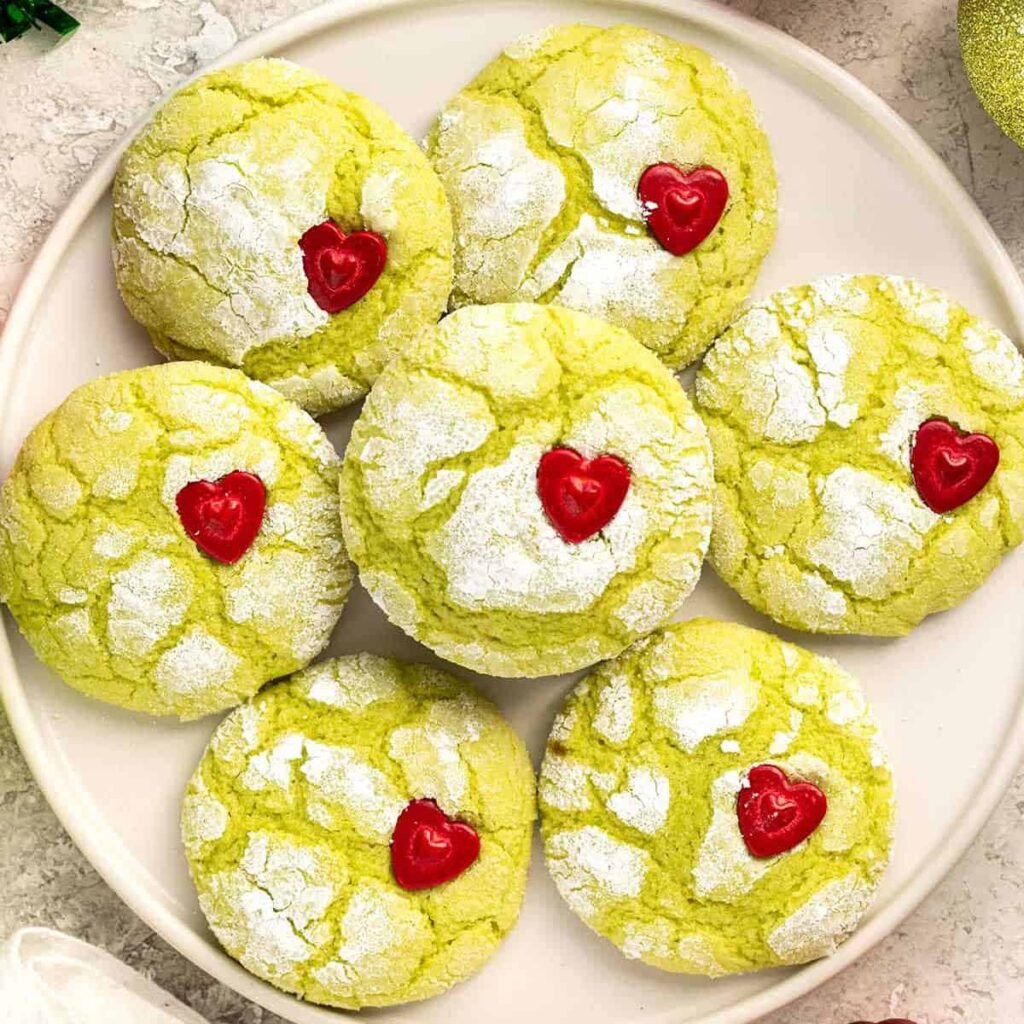 Green Grinch cookies with red heart sprinkles