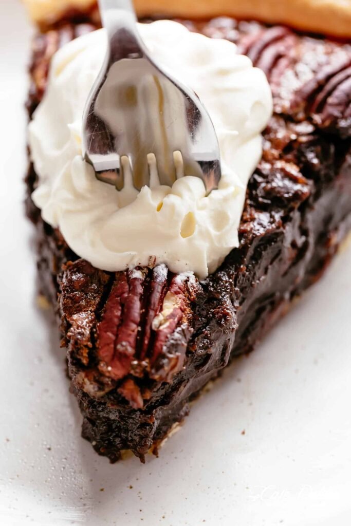 Chocolate pecan pie topped with toasted pecans