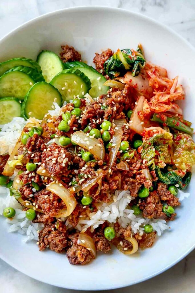 Korean ground beef bowls over rice with green onions
