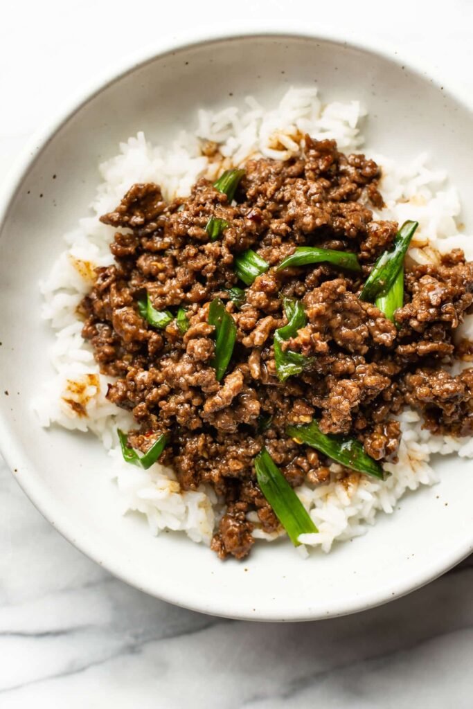 Mongolian ground beef with scallions over rice