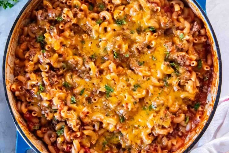 One pot ground beef pasta with melted cheddar in a skillet