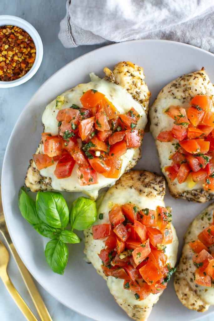 Sheet pan bruschetta chicken with mozzarella and potatoes