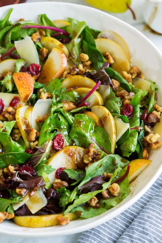 Autumn pear salad with candied walnuts and cranberries