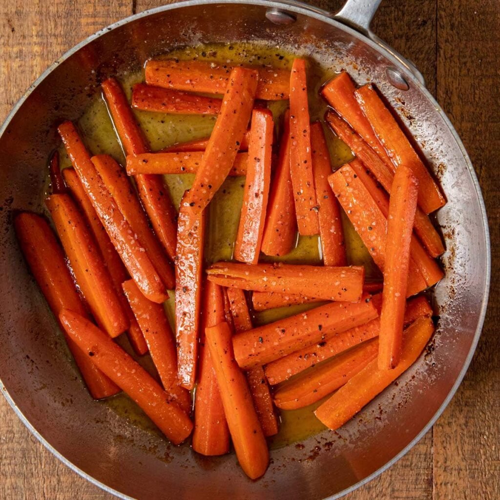 Honey glazed carrots in a skillet